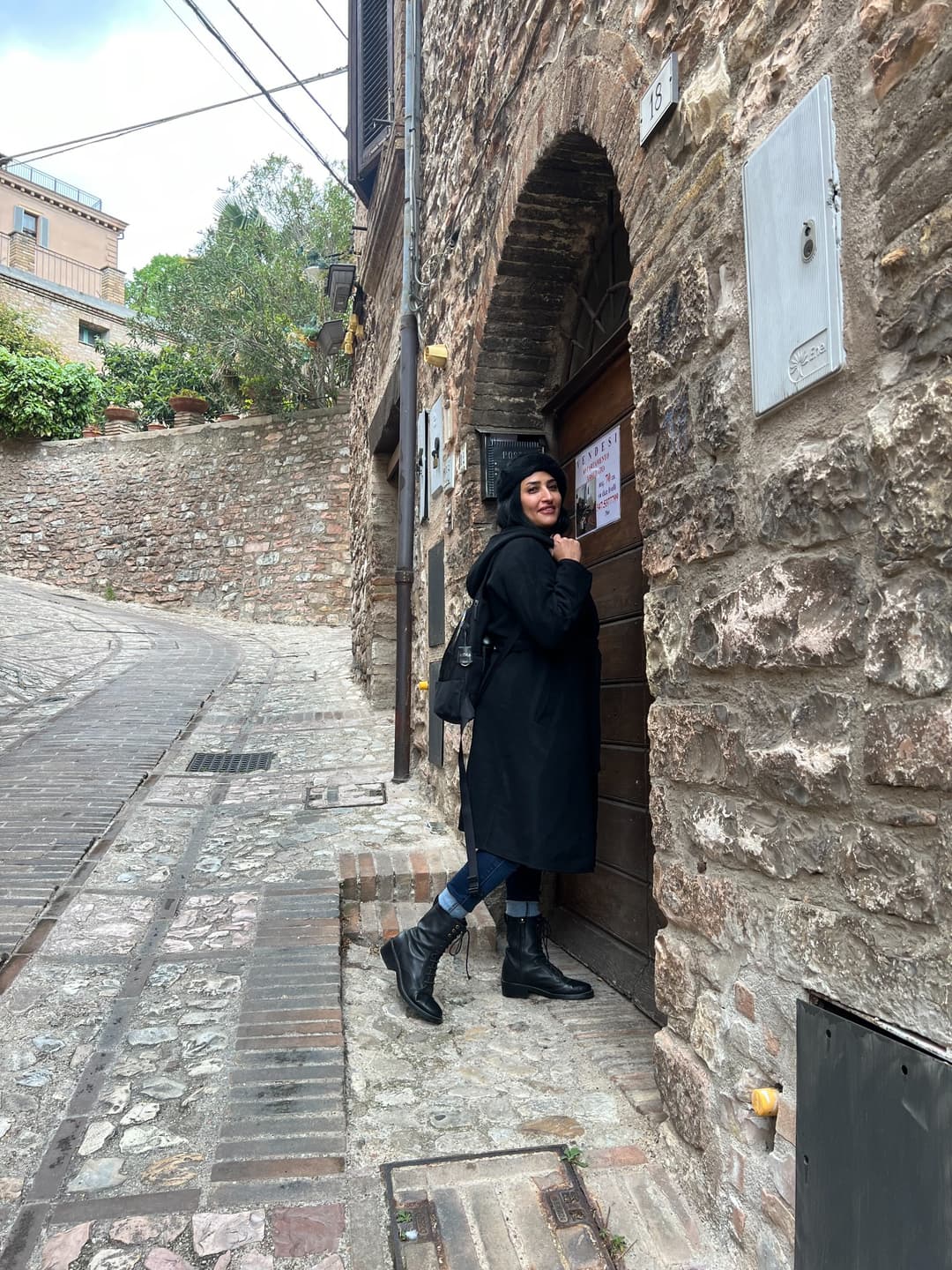 A stone lane beside one of Spello’s old doorways