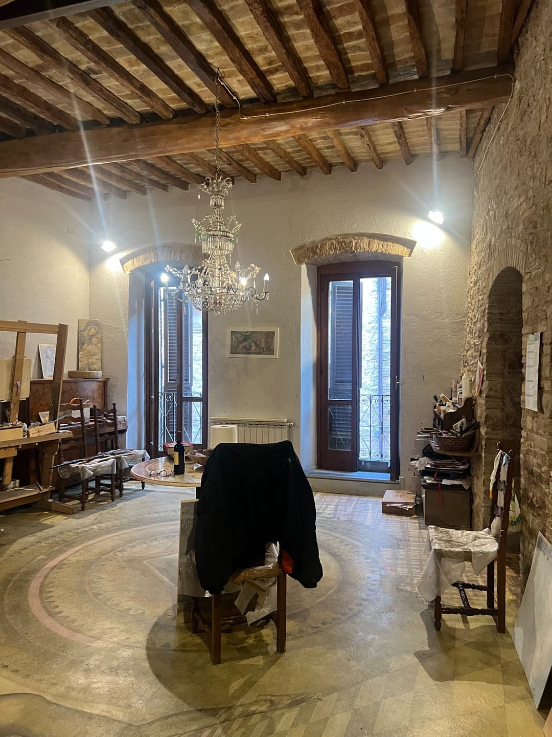 Elvio Marchionni’s studio inside a historic stone interior in Spello