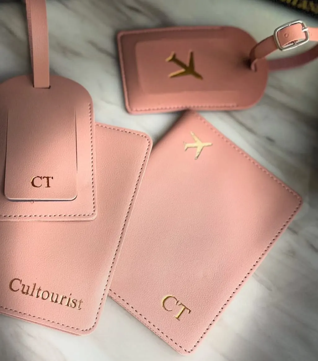 Pink Cultourist luggage tags and passport cover